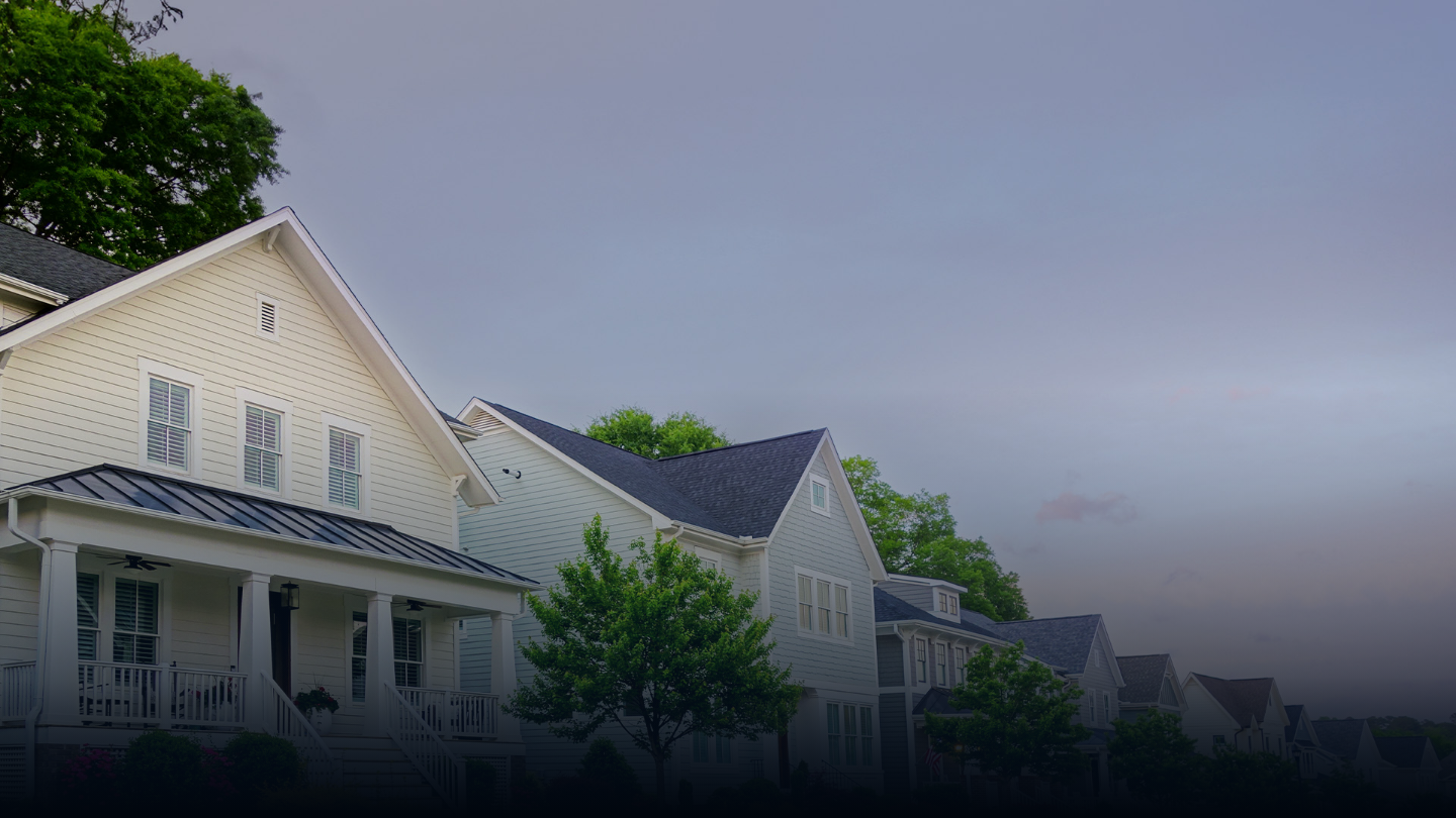 A line of well-maintained homes in a neighborhood with the Secure Vote NC logo watermarked on top